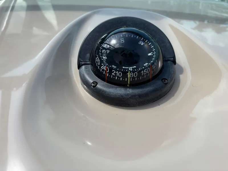 Slide: The Image of Compass on 2008 Formula 37 PC boat dashboard, showing navigation directions. - 37