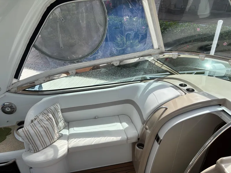 Slide: The Image of 2008 Formula 37 PC yacht interior with white seating and striped pillow. - 38