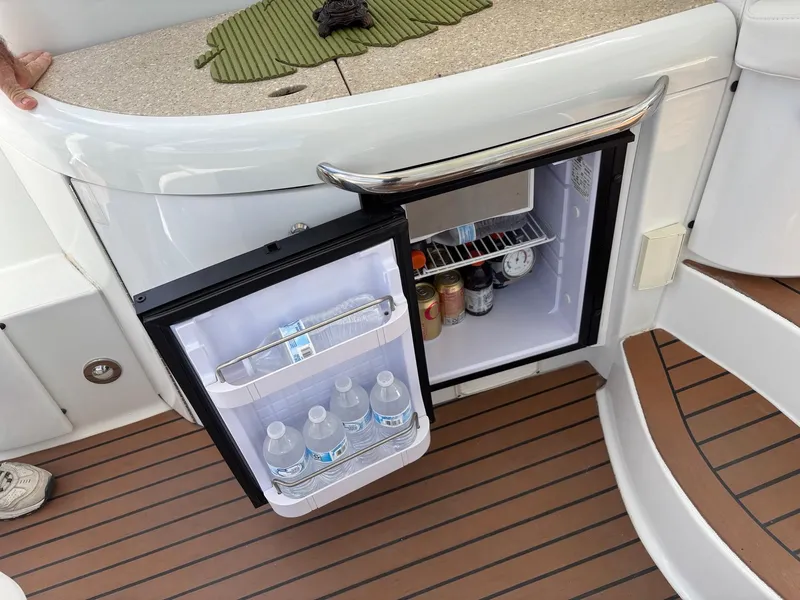 Slide: The Image of Mini fridge on 2008 Formula 37 PC yacht, stocked with drinks, open on deck. - 39