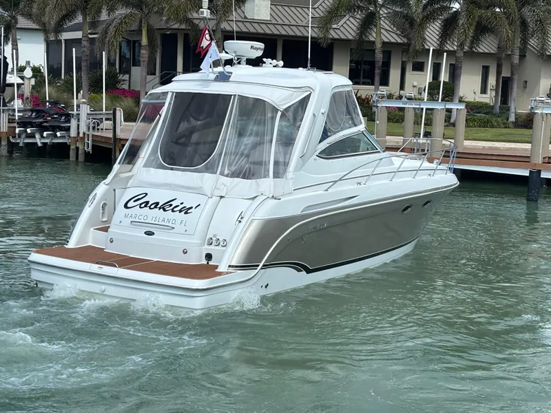 Slide: The Image of 2008 Formula 37 PC yacht cruising in a marina, featuring sleek design and clear canopy. - 4