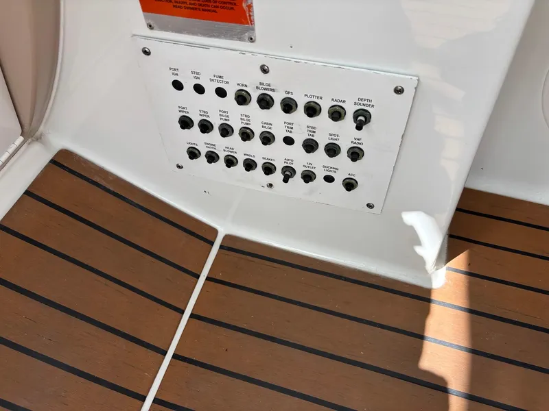 Slide: The Image of Control panel on 2008 Formula 37 PC boat with wood-patterned flooring. - 42