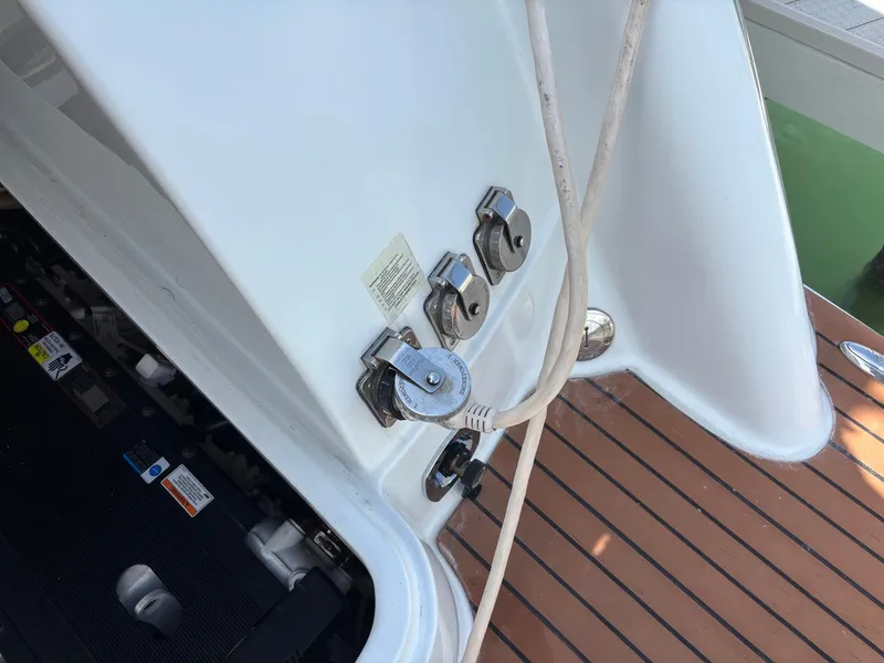 Slide: The Image of 2008 Formula 37 PC yacht deck with utility connections and wooden flooring. - 44