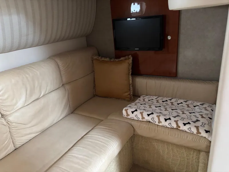 Slide: The Image of Luxurious interior of 2008 Formula 37 PC yacht with beige leather seating and TV. - 49