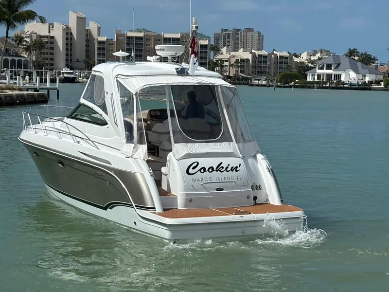 Slide: The Image of 2008 Formula 37 PC yacht cruising in a marina with waterfront buildings in the background. - 6