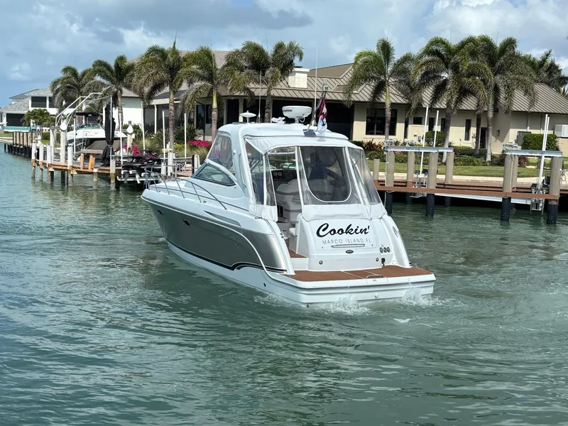 Slide: The Image of 2008 Formula 37 PC yacht cruising in a tropical marina with palm trees. - 7