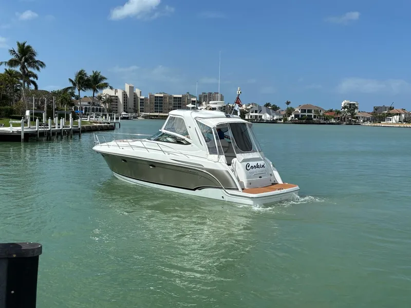 Slide: The Image of 2008 Formula 37 PC yacht cruising in a sunny coastal marina. - 8