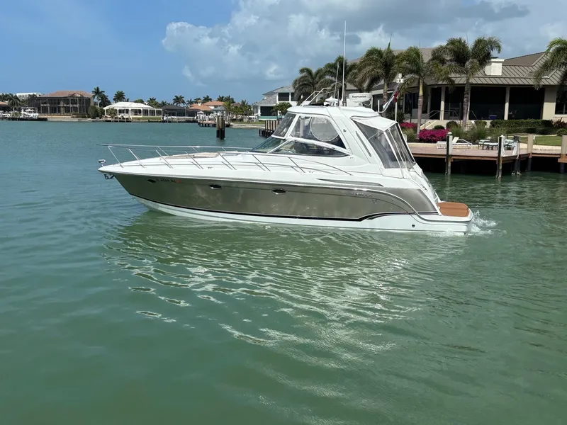 Slide: The Image of 2008 Formula 37 PC yacht cruising in a scenic waterfront area. - 9