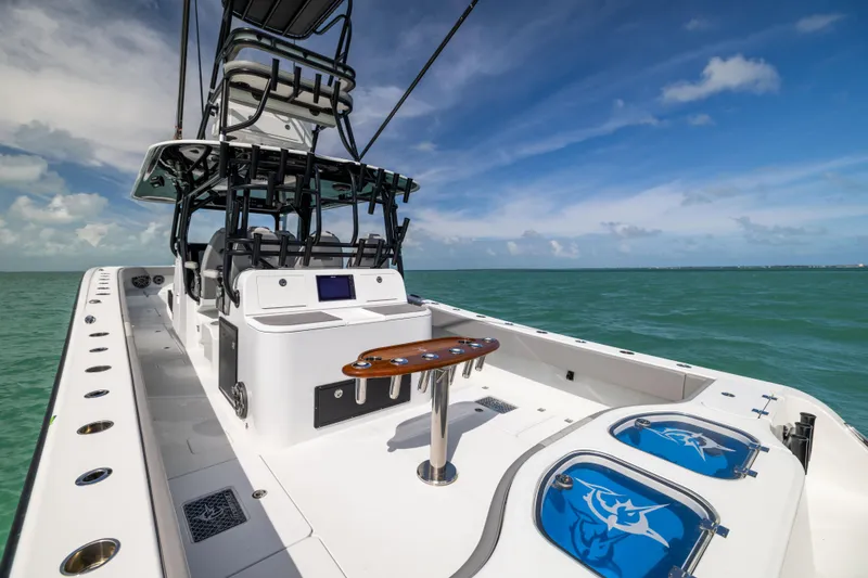 Slide: The Image of 2024 Freeman 42 LR boat on open sea, featuring sleek design and modern amenities. - 18