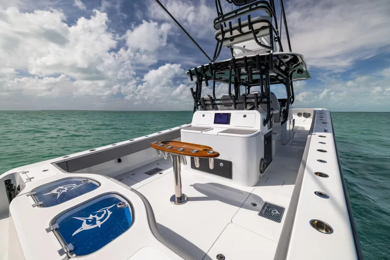 Slide: The Image of 2024 Freeman 42 LR boat on open water, featuring spacious deck and modern design. - 19