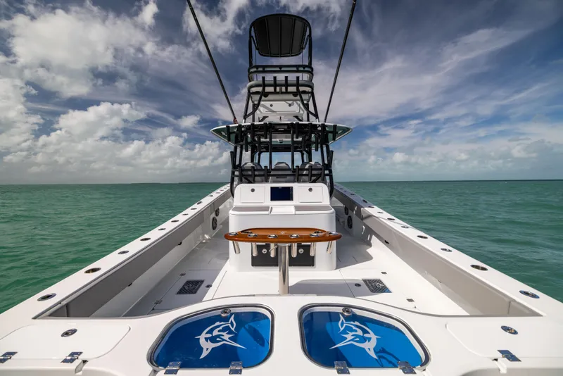 Slide: The Image of 2024 Freeman 42 LR boat on open water under a cloudy sky. - 20