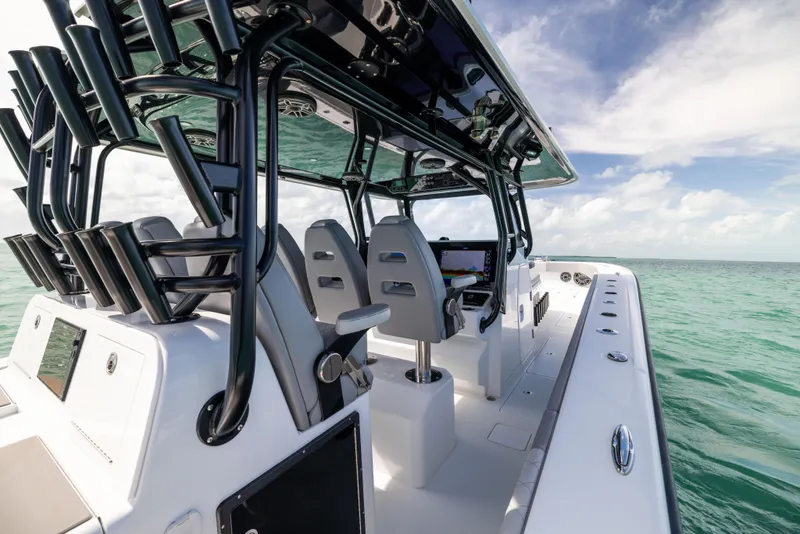 Slide: The Image of 2024 Freeman 42 LR boat on open water, featuring sleek design and modern seating. - 30