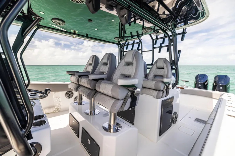Slide: The Image of 2024 Freeman 42 LR boat interior with luxury seating and ocean view. - 31