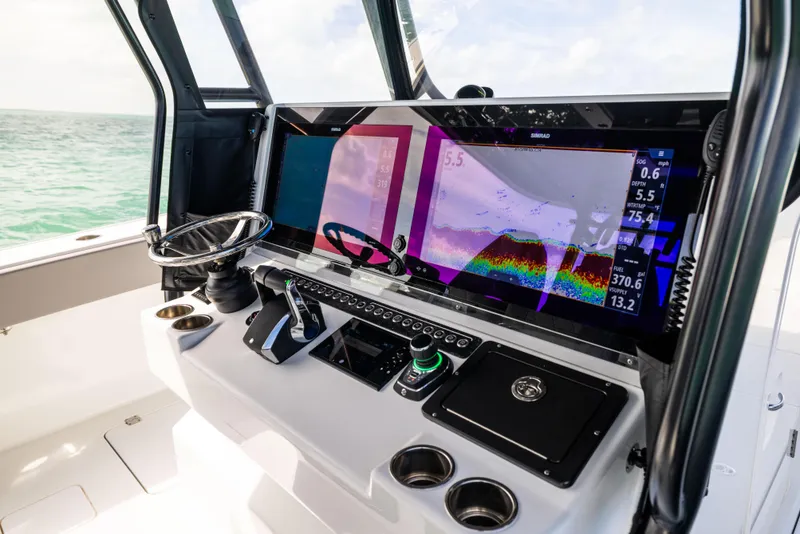 Slide: The Image of 2024 Freeman 42 LR boat dashboard with advanced navigation and control systems. - 37