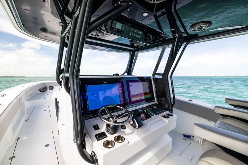 Slide: The Image of 2024 Freeman 42 LR boat cockpit with advanced navigation systems and ocean view. - 41