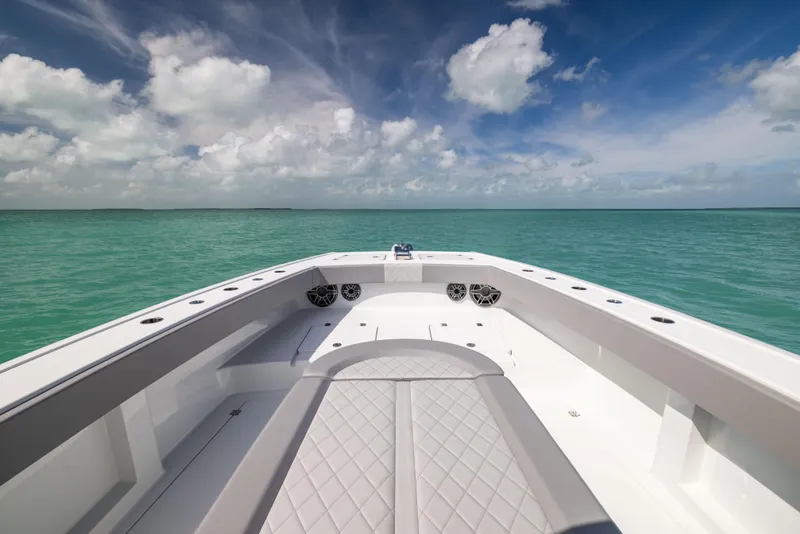 Slide: The Image of 2024 Freeman 42 LR boat on turquoise ocean under blue sky with clouds. - 47