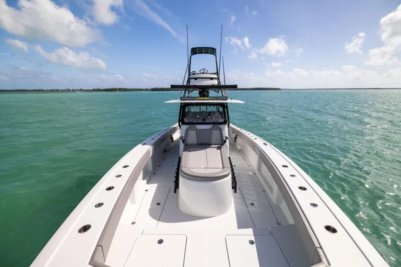 Slide: The Image of 2024 Freeman 42 LR boat on turquoise water under blue sky. - 49
