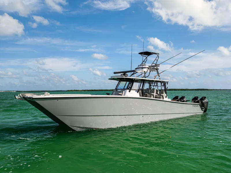 Slide: The Image of 2024 Freeman 42 LR boat on clear green water under blue sky. - 5