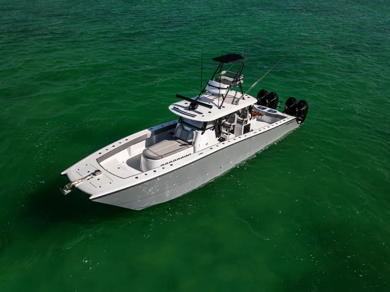 Slide: The Image of 2024 Freeman 42 LR boat on clear green water, aerial view. - 9