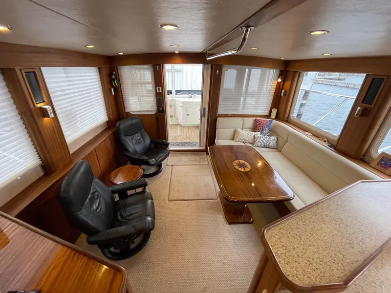Slide: The Image of Luxurious interior of 2009 American Tug 49 Limited with leather chairs and wooden accents. - 10