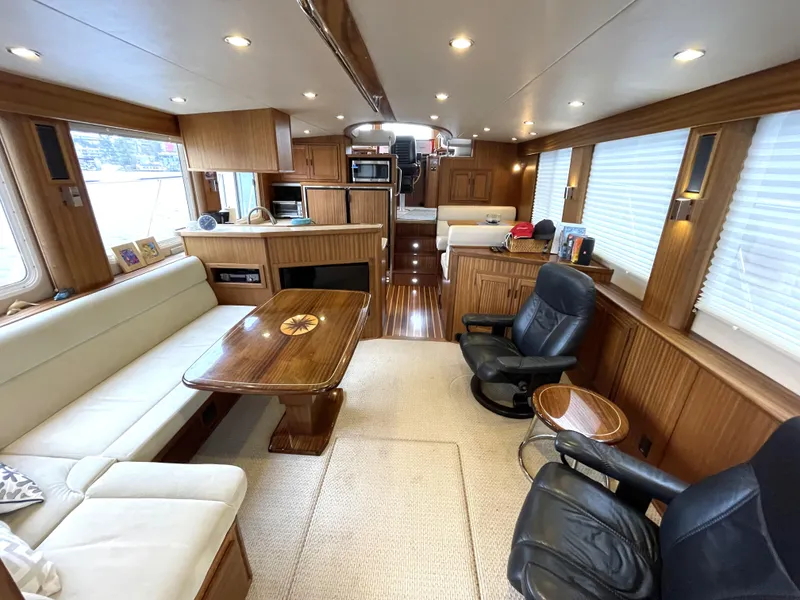 Slide: The Image of Luxurious interior of 2009 American Tug 49 Limited with elegant wood finishes and comfortable seating. - 2