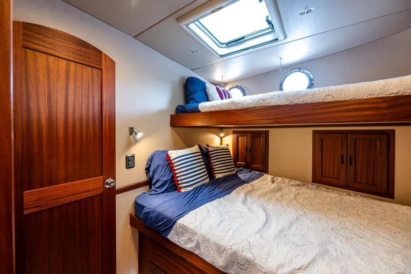 Slide: The Image of Cozy cabin interior of 2009 American Tug 49 Limited with wooden finishes and skylight. - 23