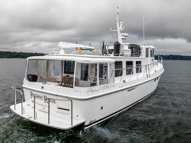 Slide: The Image of 2009 American Tug 49 Limited cruising on a cloudy day. - 29