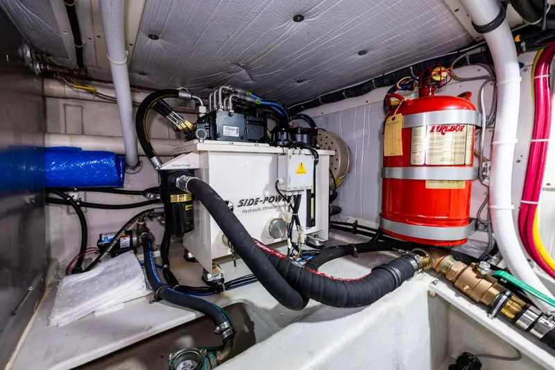 Slide: The Image of Engine room of 2009 American Tug 49 Limited with hydraulic system and fire extinguisher. - 42