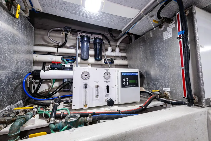 Slide: The Image of Engine room of 2009 American Tug 49 Limited with control panel and piping. - 44