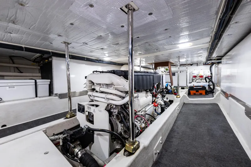 Slide: The Image of Engine room of 2009 American Tug 49 Limited, showcasing machinery and equipment. - 46