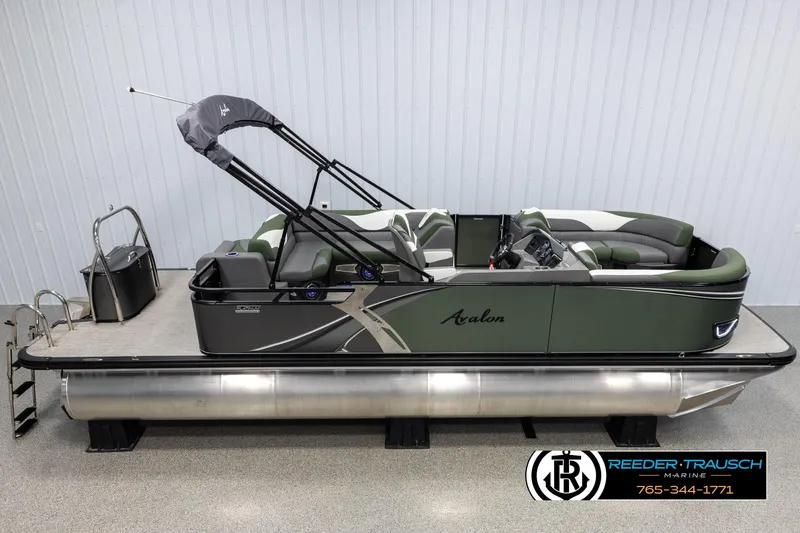 Slide: The Image of 2025 Avalon LSZ CRB pontoon boat with canopy, displayed indoors. - 1