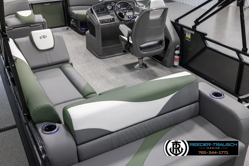 Slide: The Image of 2025 Avalon LSZ CRB boat interior with modern seating and control panel. - 11