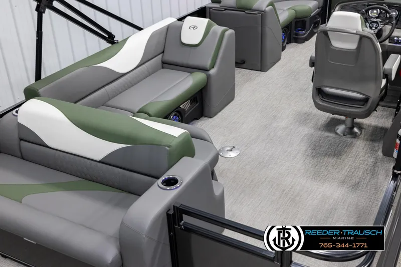 Slide: The Image of 2025 Avalon LSZ CRB pontoon boat interior with gray and green seating, modern design. - 12