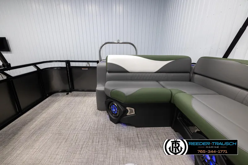 Slide: The Image of 2025 Avalon LSZ CRB boat interior with green and gray seating, modern design. - 15