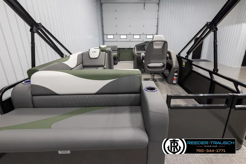 Slide: The Image of 2025 Avalon LSZ CRB pontoon boat interior with modern seating and steering console. - 16