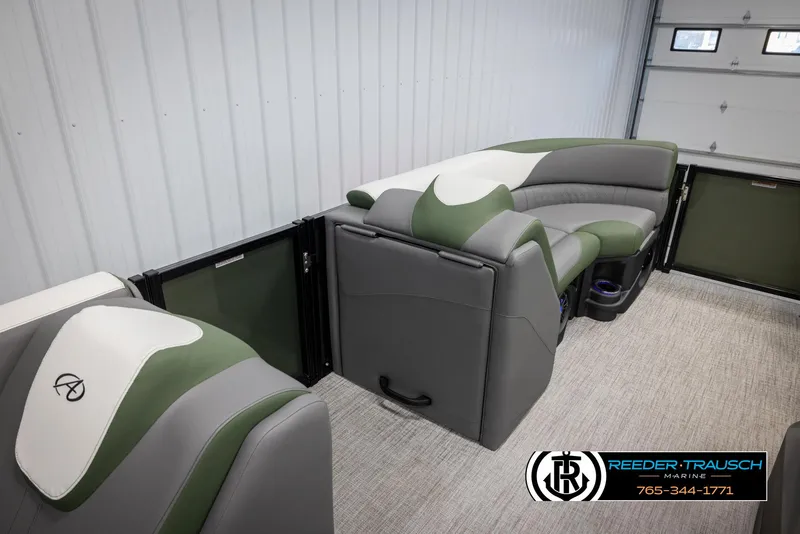 Slide: The Image of 2025 Avalon LSZ CRB boat interior with green and gray seating, modern design. - 20