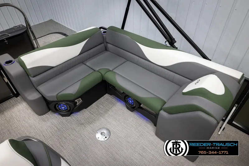 Slide: The Image of Luxurious 2025 Avalon LSZ CRB boat seating with green and gray upholstery. - 22