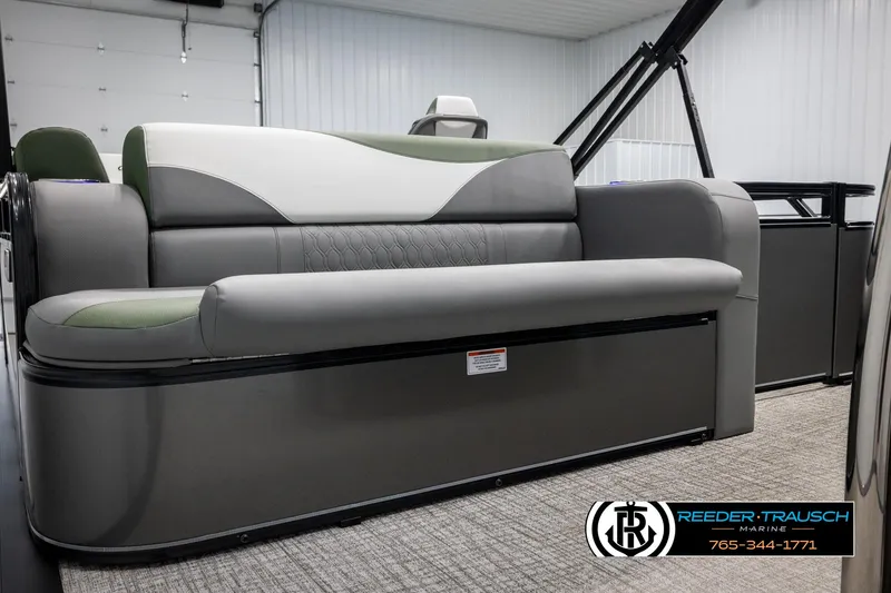 Slide: The Image of 2025 Avalon LSZ CRB boat interior with gray seating in a showroom. - 27