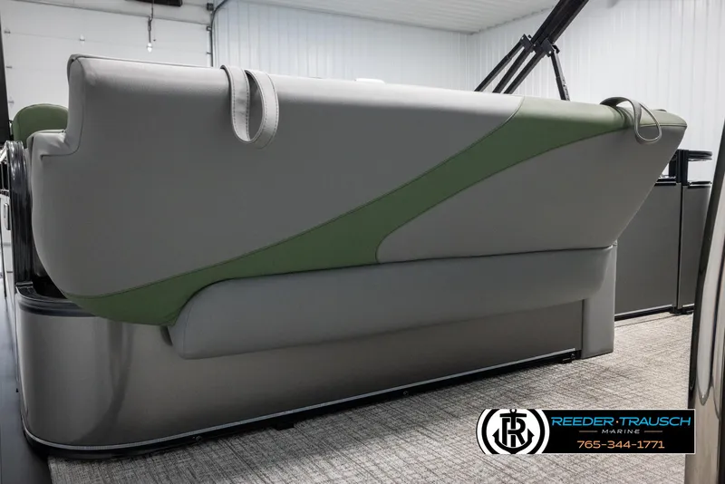 Slide: The Image of 2025 Avalon LSZ CRB boat interior with sleek seating design in a showroom. - 28