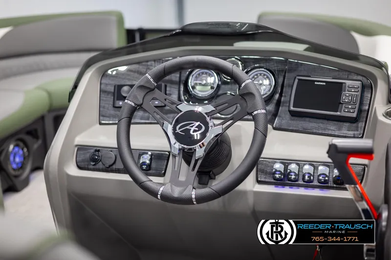 Slide: The Image of 2025 Avalon LSZ CRB boat dashboard with steering wheel and control panel. - 29