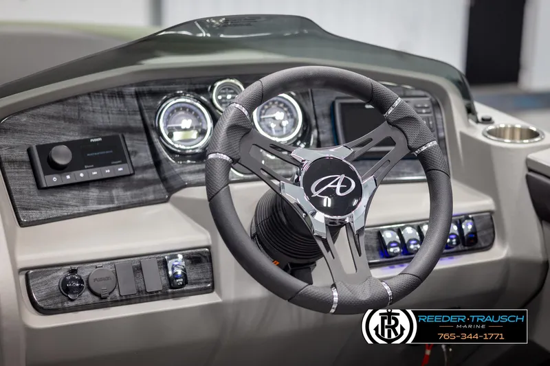 Slide: The Image of 2025 Avalon LSZ CRB boat dashboard with modern steering wheel and controls. - 30