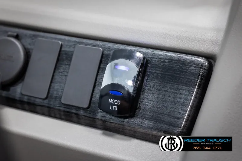 Slide: The Image of 2025 Avalon LSZ CRB mood lighting switch panel with Reeder-Trausch Marine branding. - 32