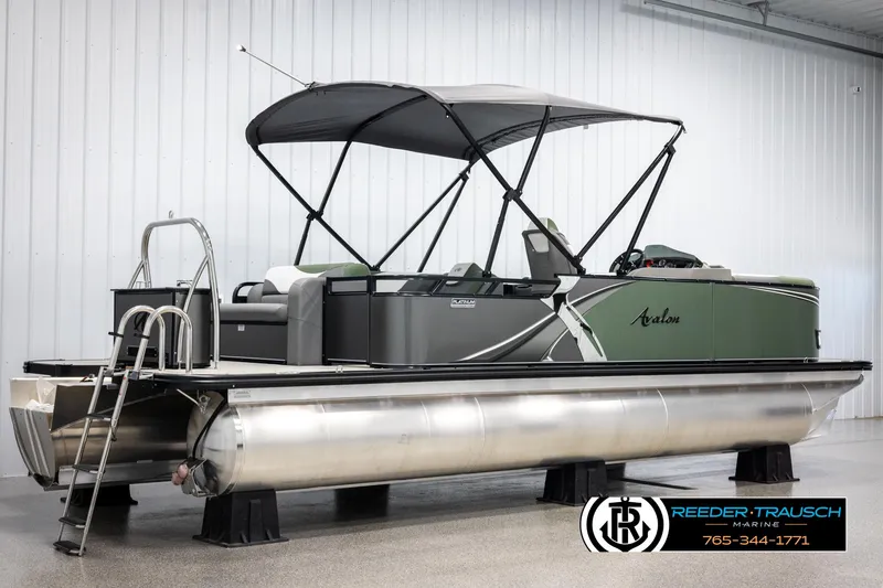 Slide: The Image of 2025 Avalon LSZ CRB pontoon boat with canopy in showroom. - 6