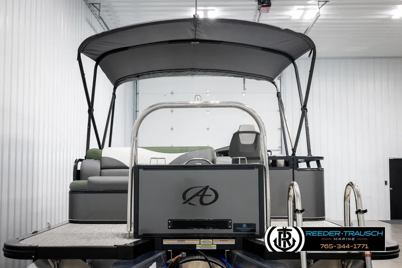 Slide: The Image of 2025 Avalon LSZ CRB pontoon boat with canopy in a showroom. - 7