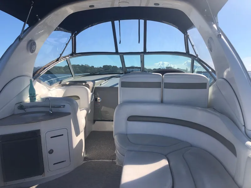 Slide: The Image of Interior of a 2006 Sea Ray 320 Sundancer boat with seating and helm. - 11