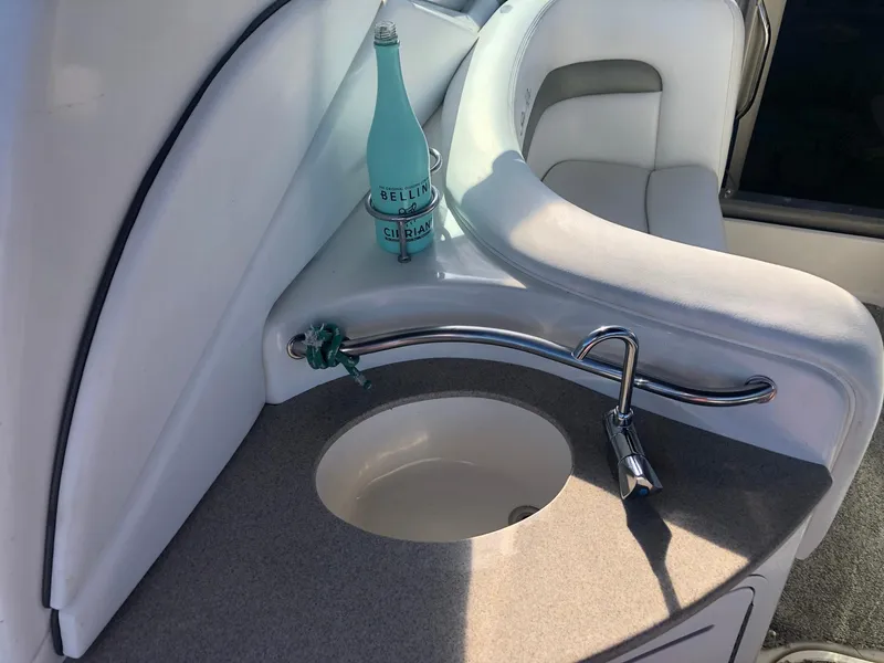 Slide: The Image of 2006 Sea Ray 320 Sundancer interior with sink and seating area. - 18