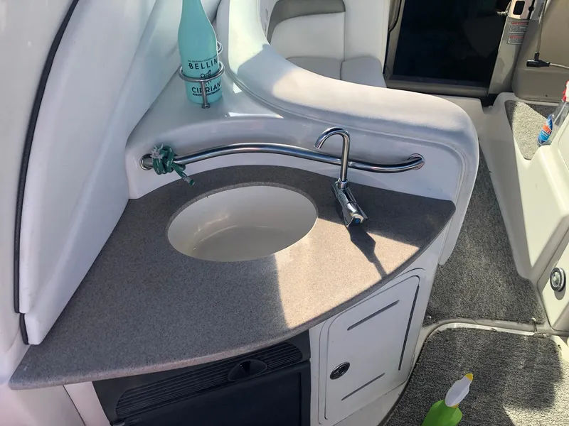 Slide: The Image of 2006 Sea Ray 320 Sundancer boat interior with sink and countertop. - 19