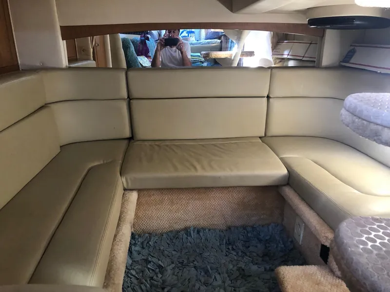 Slide: The Image of Interior of 2006 Sea Ray 320 Sundancer with beige seating and carpet. - 26