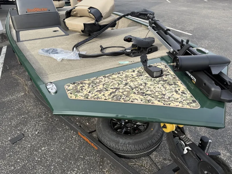 Slide: The Image of 2025 Tracker Bass Tracker Classic Limited boat with camouflage deck and mounted trolling motor. - 10