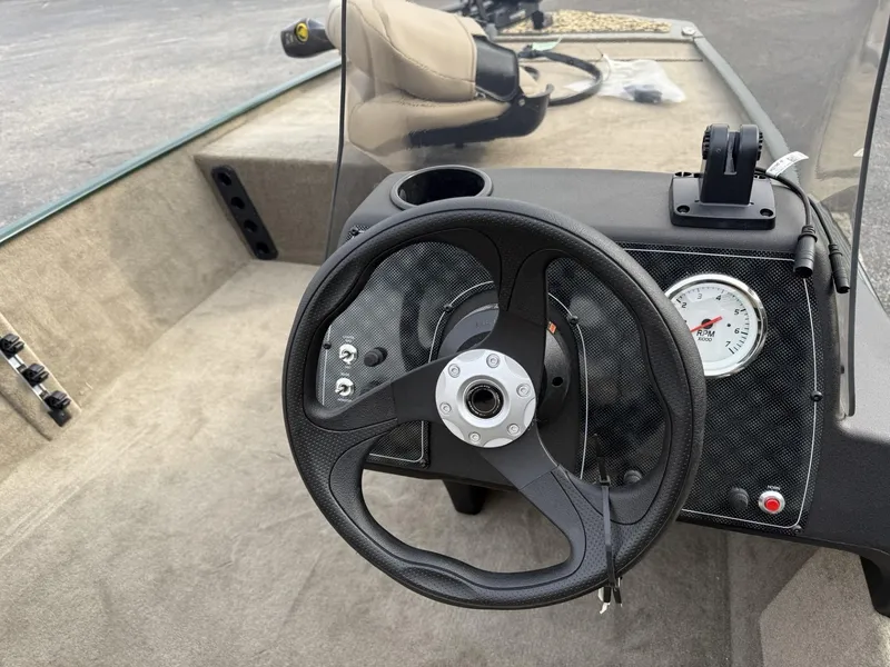Slide: The Image of 2025 Tracker Bass Tracker Classic Limited boat steering wheel and dashboard. - 12