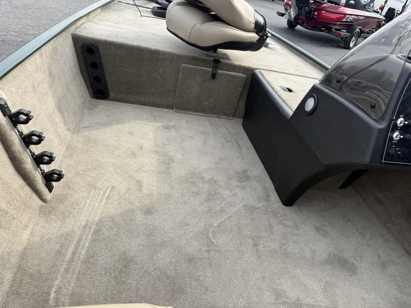 Slide: The Image of 2025 Tracker Bass Tracker Classic Limited boat interior with seating and storage compartments. - 13